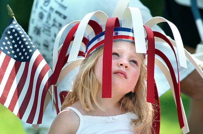 A girl displays her patriotism during a Fourth of July parade in 2006 at the Morgan Sports Center.