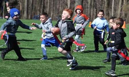 9/11 Youth Flag Football action in Bloomingdale Park
