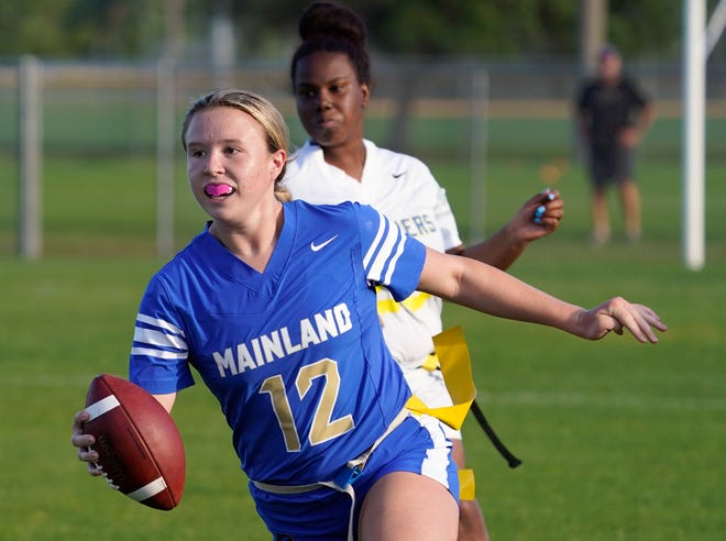 Alexa Wilson (12) ran for a touchdown and threw another in Mainland's 14-0 win over Deltona in Friday's District 5-1A flag football final.