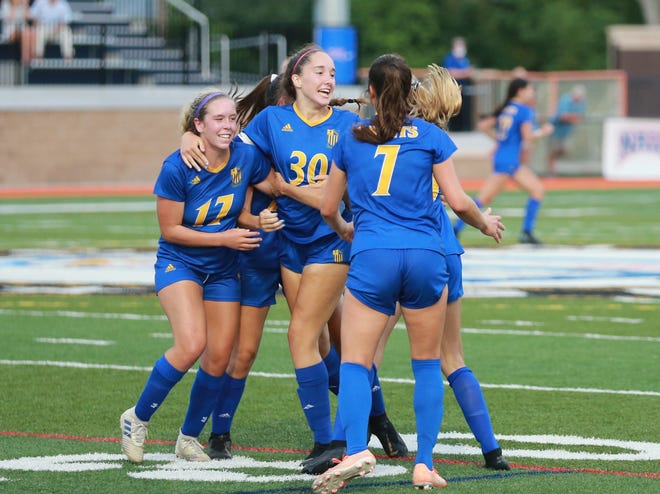 St. Vincent's Academy's Emma Beddow celebrates with her teammates after scoring a game-tying goal in the second half of a GHSA Class A Private playoff game May 4 at Memorial Stadium. Holy Innocents advanced to the state semifinals with a 4-1 edge over SVA on penalty kicks.