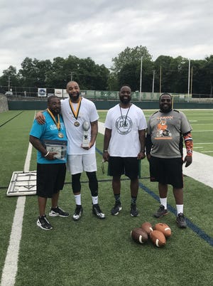 From left to right: Tim Anderson of The Fallen Fathers Foundation, Romeo Travis, team captain of winning flag football team from 2019, Willie McGee The D.A.L.E Program founder and STVM athletic director and Donte Swain of Akron Bengals Youth Football after the 2019 game.