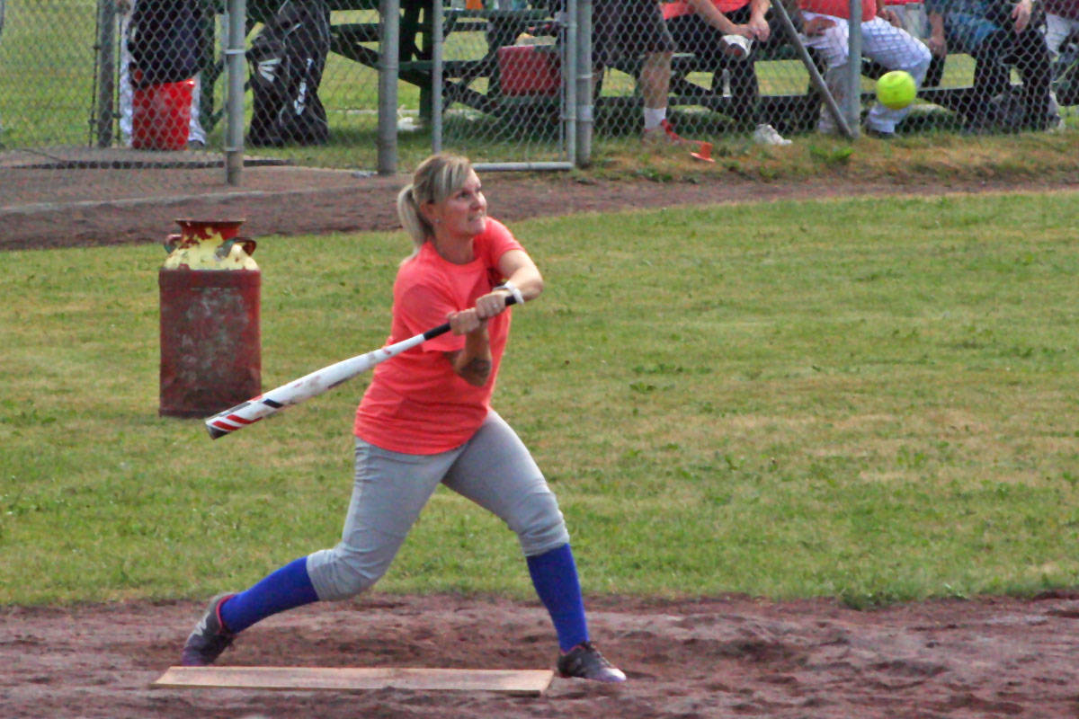 Tiffany Campbell of Longname keeps her eye on the ball as she hits in the final game of the fundraising tournament. Her team would win, taking home a $200 wings gift card. (Cassidy Dankochik Photo - Quesnel Cariboo Observer)