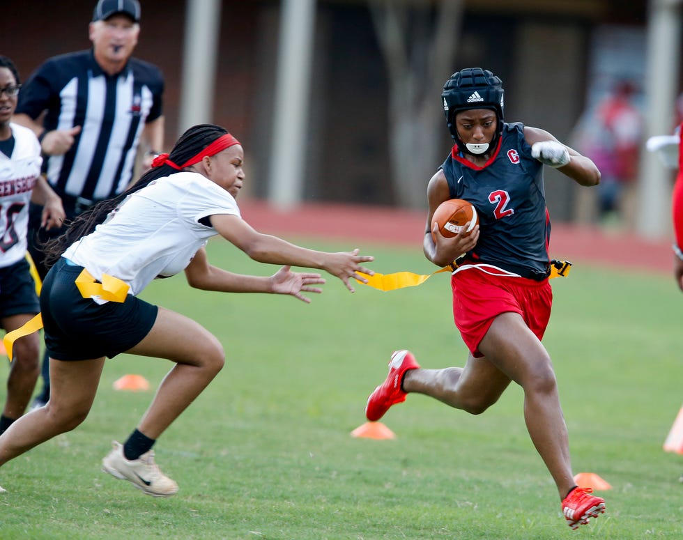 Central High hosted Greensboro High in the first AHSAA sanctioned flag football game in the area Tuesday Sept. 21, 2021. Chyna Foster dashes away from a would-be tackler. [Staff Photo/Gary Cosby Jr.]