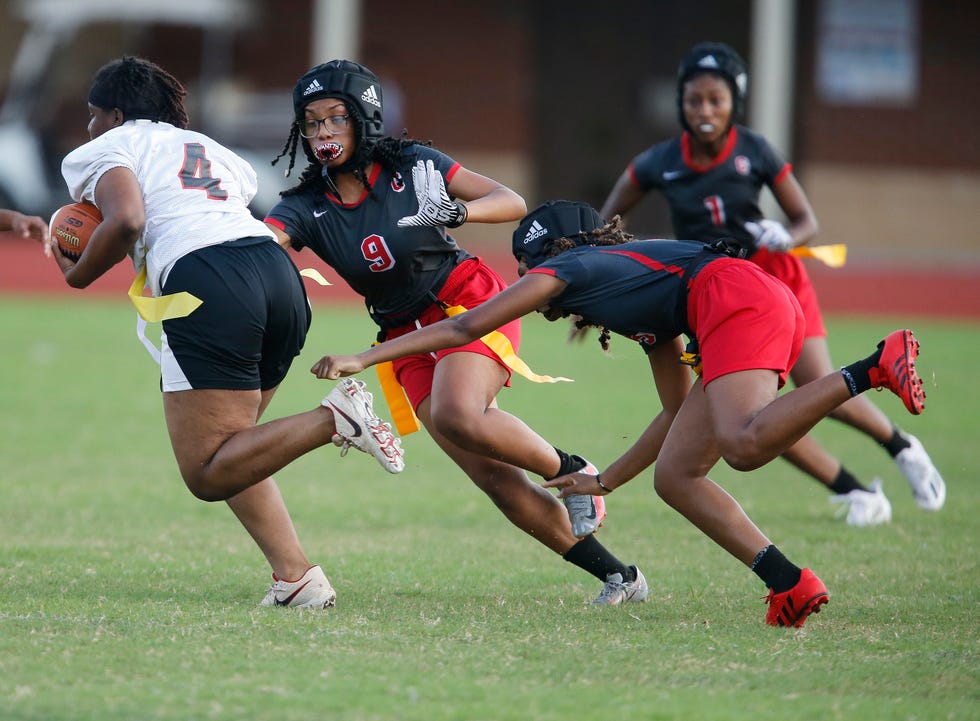 Central High hosted Greensboro High in the first AHSAA offered flag football game in the area Tuesday Sept. 21, 2021. Central High defender Kayroi Ryan closes in on Greensboro runner Sarah Garrett. [Staff Photo/Gary Cosby Jr.]