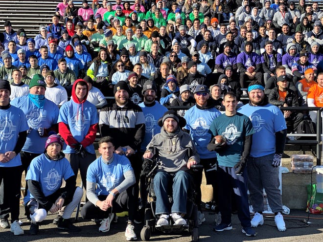 Tommy's Turkey Bowl participants join with Tommy McGuire (c, front row) during a past Turkey Bowl at Clarkstown South High School. The fifth Turkey Bowl fundraiser will be held Saturday.