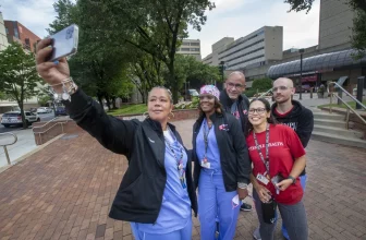 Temple University trauma advocates stopped for a selfie before returning to their building this summer. From left are Sadiqa Lucas, Rose King, Scott Charles, Leslie Ramirez, and Ian Hirst-Hermans.