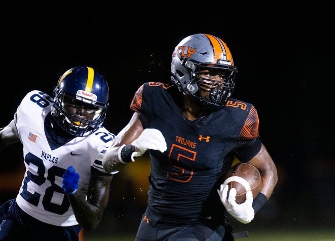 Lely's Coby Georges (5) runs the ball during the Naples and Lely 48th Coconut Bowl at Lely High School in Naples, Fla., on Friday, Oct. 15, 2021.