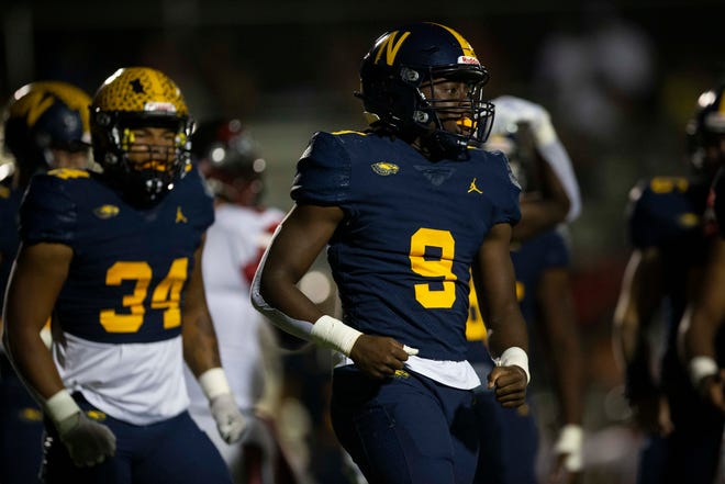 Naples' Andrew Saint Fleur (9) celebrates after making a play during the first half of the de facto Florida 6A District 14 championship between South Fort Myers and Naples, Friday, Oct. 22, 2021, at Naples High School in Naples, Fla.Naples led 30-12 at halftime and 51-19.