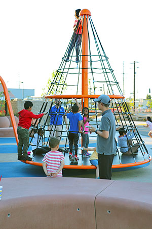 A kid-powered spinner in the play area on the west side of Lexington Park is a big hit with children! Photo by C.E.H. Wiedel.