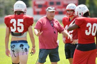 Hilliard Middle Senior High School head football coach John Pate instructs his players during the Hilliard Red Flashes' football practice Wednesday, August 11, 2021. [Bob Self/Florida Times-Union]