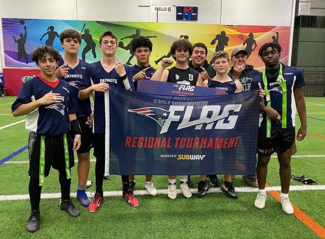 An NFL FLAG Football team from the Northeast region holds a flag after winning a regional tournament in New Jersey and the right to play during the Pro Bowl in Las Vegas earlier this year.