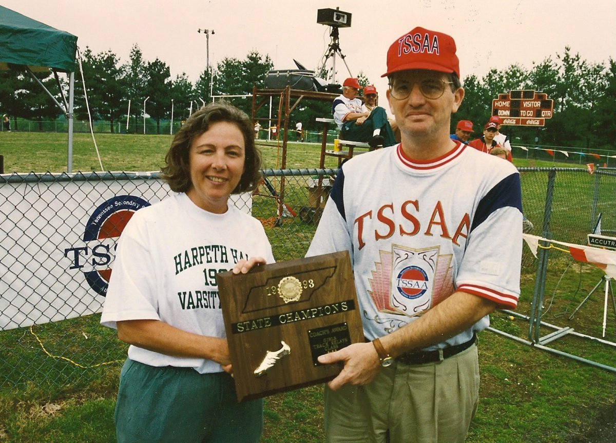 Long-time Harpeth Hall coach Susan Russ accepts the 1993 Girls' Relay Champion coaches plaque from TSSAA Executive Director Ronnie Carter.