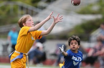 A Commanders player makes a catch against the Bolts as flag football teams compete at Central Kitsap's Cougar Field on Thursday, June 23, 2022. The Peninsula Flag League fields teams of players from kindergarten through eighth grade.