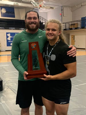 Father Lopez head coach Daniel Fish and star Jackson Oldham lead the Green Wave to a traditional weightlifting district title.