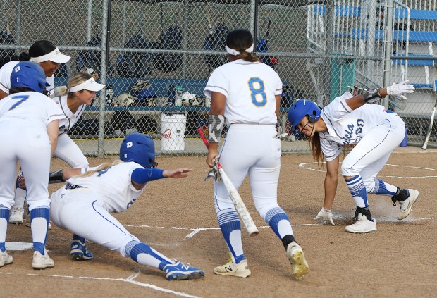 Benicia's Braxton Brown reaches down to touch the line as she runs to celebrate her home run with her team during the Panther's 17-0 win in the fifth inning over Alhambra. (Chris Riley/Times-Herald)