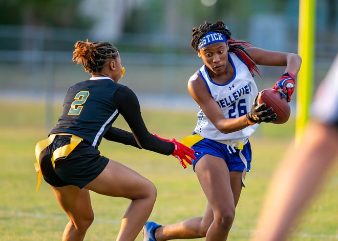 Belleview Jakyra Bostick (26) evades Forest Kania Dean (2) as Forest travels to Belleview for the MCIAC championship Thursday, April 6, 2023, at Belleview High School in Belleview, Fla. Belleview won 13-12 in overtime. [Alan Youngblood/Special to the Ocala Star-Banner]