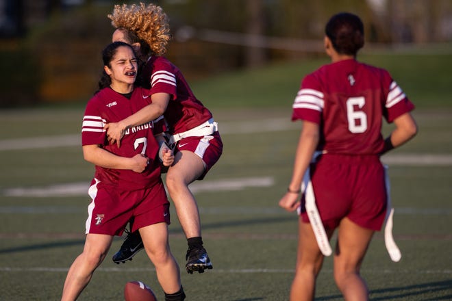 Fitchburg's Angie Alvarez, left, celebrates with Xaimary Rodriguez, center, and Jeyline Melendez after intercepting a ball versus Leominster Thursday night at Doyle Field.