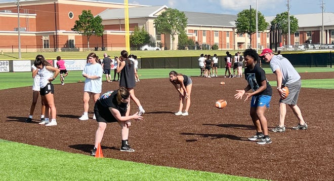 Potential players are pictured Tuesday at tryouts for Gadsden City High School's first girls' flag football team.
