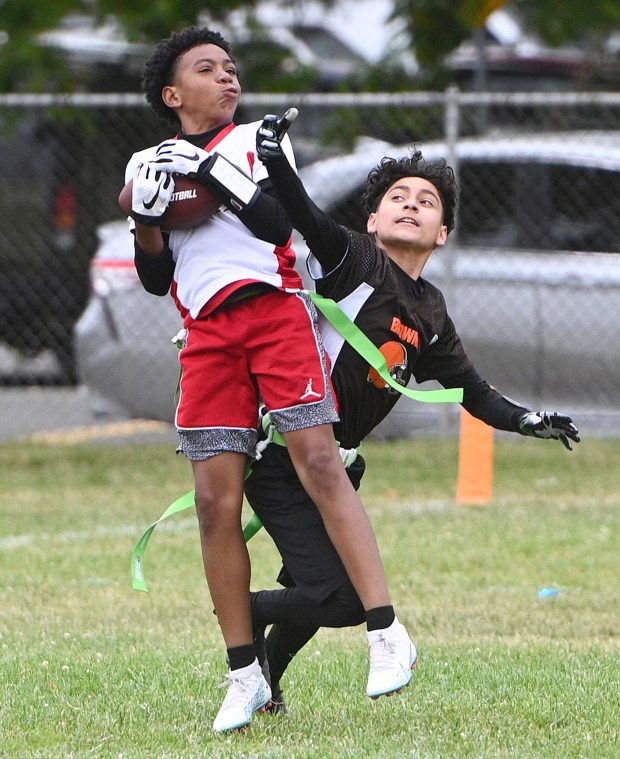 Markael Abston halls in a deep pass during the Cardinals' game against the Browns in the Coach Sarna League flag football championships on Saturday in Vallejo. (Chris Riley/Times-Herald)