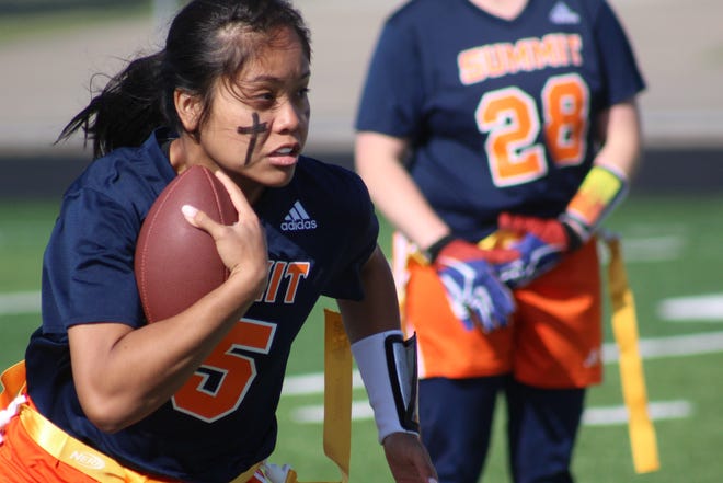 Summit quarterback Nicole Rizane runs the ball against Independence in the Williamson County Girls Flag Football Championships' semifinals.