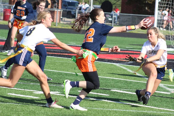 Summit's Dee Dee May runs the ball and tries to get to the end zone against Independence during the Williamson County Girls Flag Football tournament semifinals. Independence's Georgia Deeds (8) and Grace Martin (right) defend on the play.