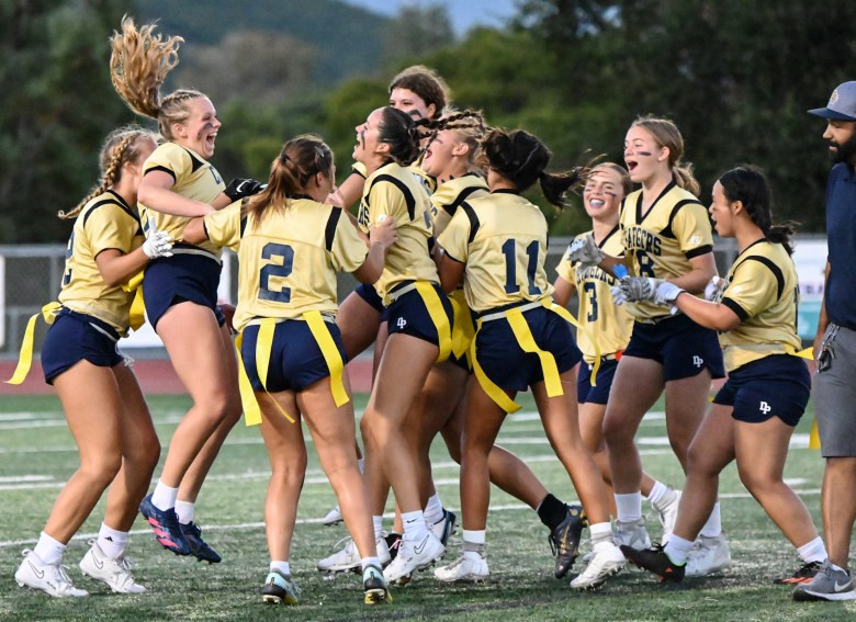 Dos Pueblos High’s 7-on-7 flag football team celebrates after the final whistle of its 26-0 victory over Bishop Diego at Scott O’Leary Stadium on Aug. 24. The game was the first ever played by both schools in the new sport. (Lily Chubb / Noozhawk photo)