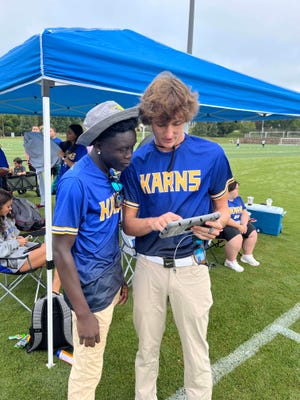 Karns High School Special Olympics coaches Warda Apiat and Walker Lockhart go all out with an iPad planning strategy at the Special Olympics regional flag football invitational at the UT RecSports Field on Sutherland Avenue in Knoxville, Tennessee, Sept. 9, 2023.