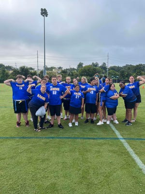 The Karns High School Special Olympics flag football team does a little flexing at the Special Olympics regional invitational at the UT RecSports Field on Sutherland Avenue in Knoxville, Tennessee, Sept. 9, 2023.