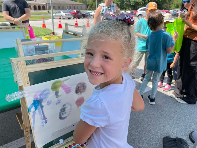 Makinley Fillers, 6, said easel painting was her favorite and she’s painting the sky at the annual Art Fest at the Farragut Community Center Sept. 10, 2023.