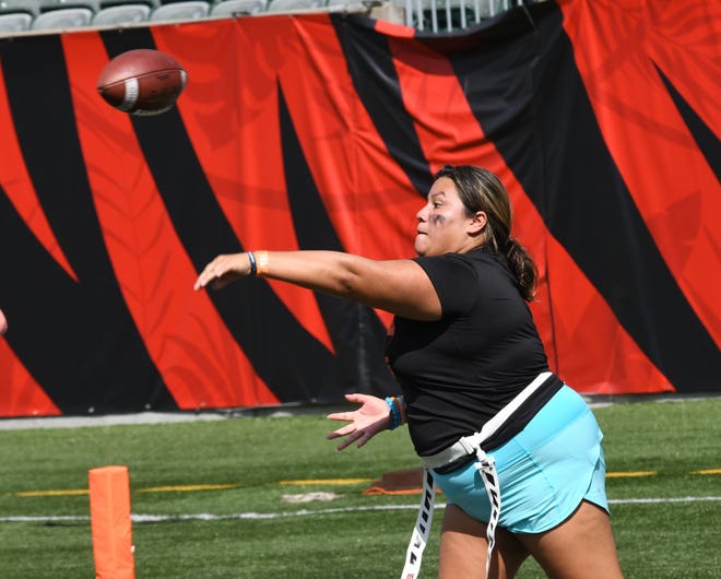 Making a completed pass is this player at the girls flag football kickoff jamboree sponsored by USA Flag Football and the Cincinnati Bengals at Paycor Stadium, Sept. 30, 2023.