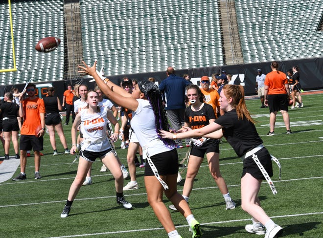 This player looks to bring a catch at the girls flag football kickoff jamboree sponsored by USA Flag Football and the Cincinnati Bengals at Paycor Stadium, Sept. 30, 2023.