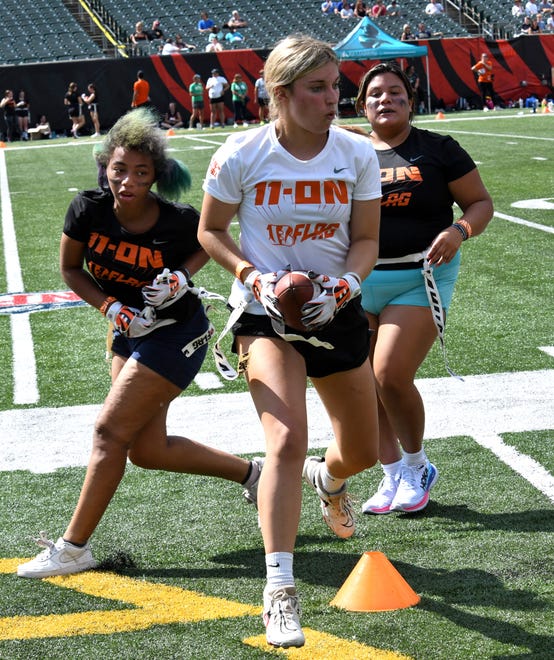 This player picks up a touchdown at the girls flag football kickoff jamboree sponsored by USA Flag Football and the Cincinnati Bengals at Paycor Stadium, Sept. 30, 2023.