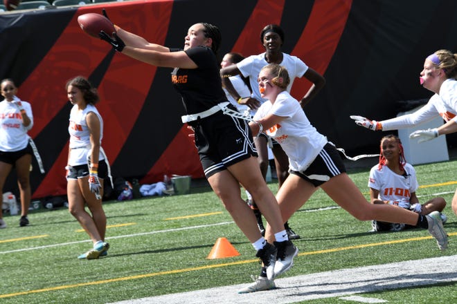 This receiver makes a fingertip catch at the girls flag football kickoff jamboree sponsored by USA Flag Football and the Cincinnati Bengals at Paycor Stadium, Sept. 30, 2023.