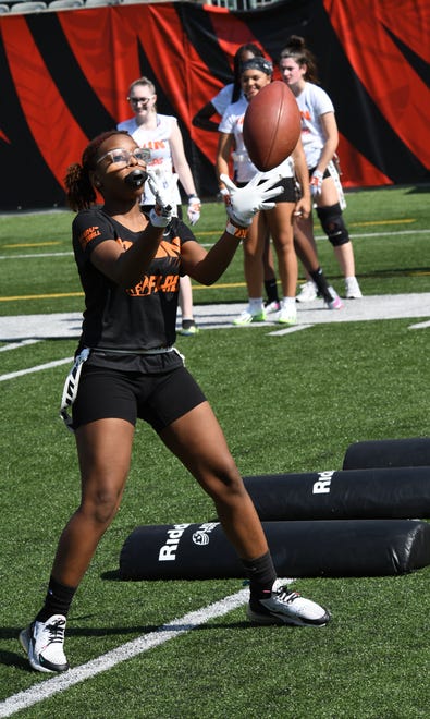 This player makes a catch during drills at the girls flag football kickoff jamboree sponsored by USA Flag Football and the Cincinnati Bengals at Paycor Stadium, Sept. 30, 2023.