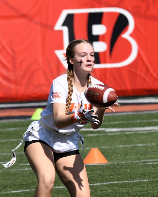This player has eyes of concentration on a catch at the girls flag football kickoff jamboree sponsored by USA Flag Football and the Cincinnati Bengals at Paycor Stadium, Sept. 30, 2023.