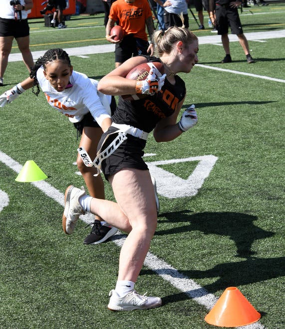 This player breaks free on a run at the girls flag football kickoff jamboree sponsored by USA Flag Football and the Cincinnati Bengals at Paycor Stadium, Sept. 30, 2023.
