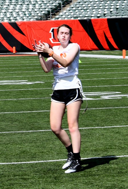 This player makes a catch off of a short pass at the girls flag football kickoff jamboree sponsored by USA Flag Football and the Cincinnati Bengals at Paycor Stadium, Sept. 30, 2023.