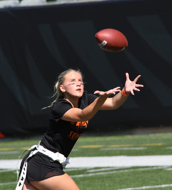 This athlete looks in a long pass reception at the girls flag football kickoff jamboree sponsored by USA Flag Football and the Cincinnati Bengals at Paycor Stadium, Sept. 30, 2023.