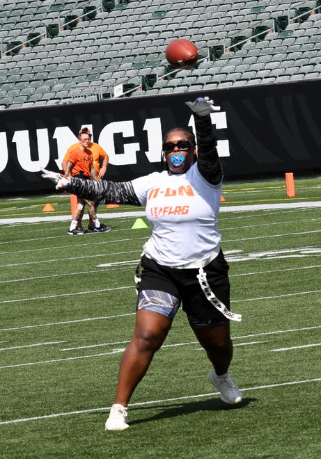 This athlete sees a short pass completion at the girls flag football kickoff jamboree sponsored by USA Flag Football and the Cincinnati Bengals at Paycor Stadium, Sept. 30, 2023.