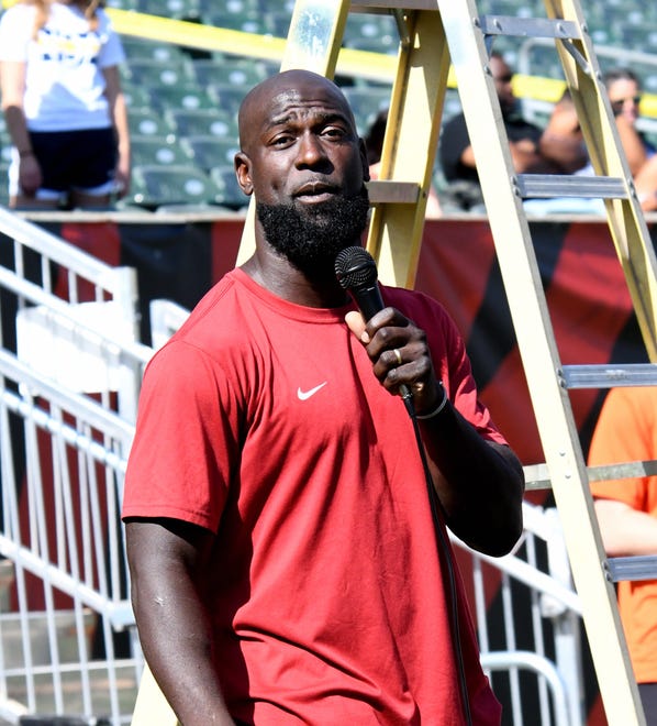 Germaine Pratt speaks to the teams for the Cincinnati Bengals at the girls flag football kickoff jamboree sponsored by USA Flag Football and the Cincinnati Bengals at Paycor Stadium, Sept. 30, 2023.