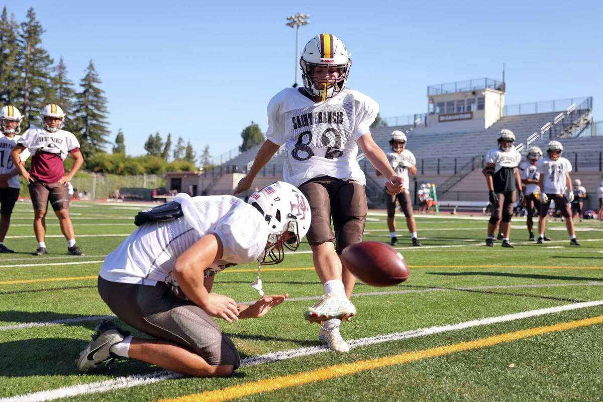 St. Francis High School football player Coco Heith works on her placekicking during practice in Mountain View.