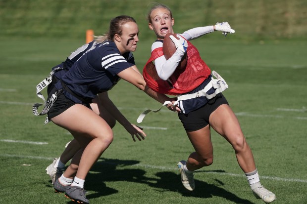 Ralston Valley High School's Addie Caldwell (15) dodges having her flag pulled by Columbine High School's Emily Allison (3) at Centura Health Training Center on Saturday, October 14, 2023 in Englewood, Colorado. The Denver Broncos hosted the Broncos Girls High School Flag Football tournament bringing together Denver Public Schools, Cherry Creek Schools and Jeffco High Schools to compete for the championship title. (Rebecca Slezak/ Special to The Denver Post)