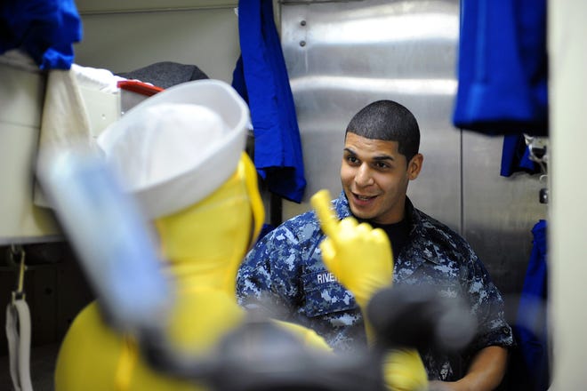 Ship's Servicemen 2nd Class Jose Rivera and Electronics Technician 3rd Class Juan Serret (yellow suit) perform a skit for Naval Station Mayport's Coalition of Sailors Against Destructive Decisions (CSADD). CSADD is a peer-to-peer mentorship program used Navy-wide that is geared at Sailors 18 to 25 years old and reinforce the Navy's culture of "Shipmates helping Shipmates."