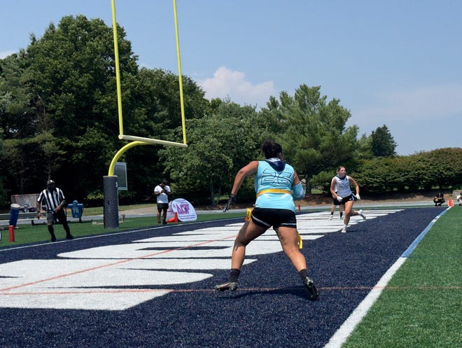 Ava Slinchak runs past defenders to get open in the end zone.