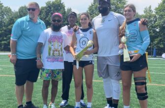 Former Philadelphia Eagle and Neptune standout Vinny Curry (second from right) poses with the game MVPs.